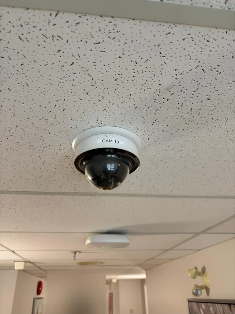 Dome camera labelled CAM 10 in a corridor ceiling