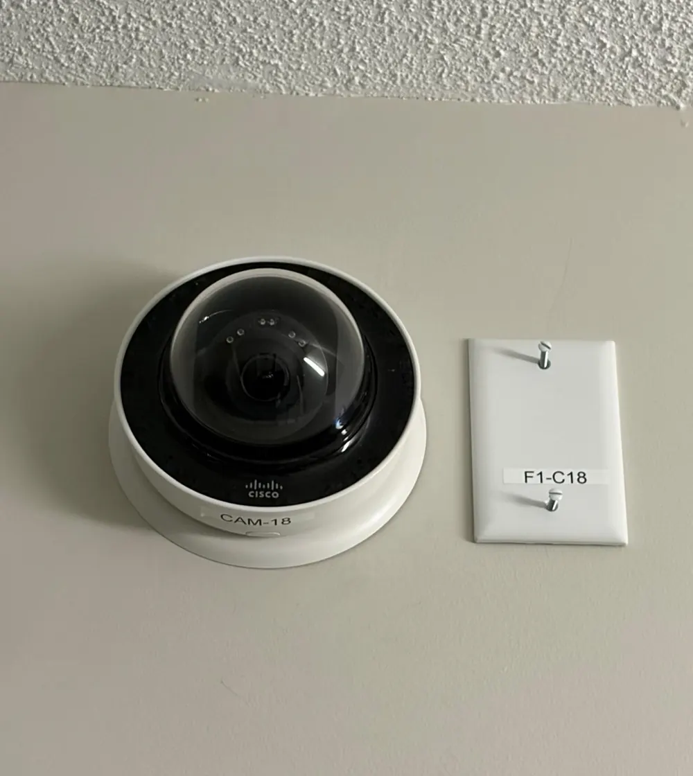 Camera labelled CAM-18 beside wall plate F1-C18